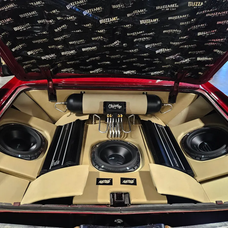 Custom trunk audio build with three subwoofers and two amplifiers
